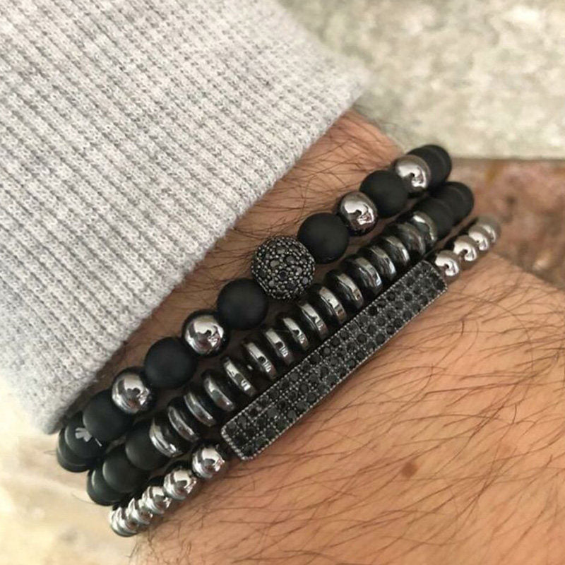 Men's matte black bracelet stack with bead, disc and pavé-look accents